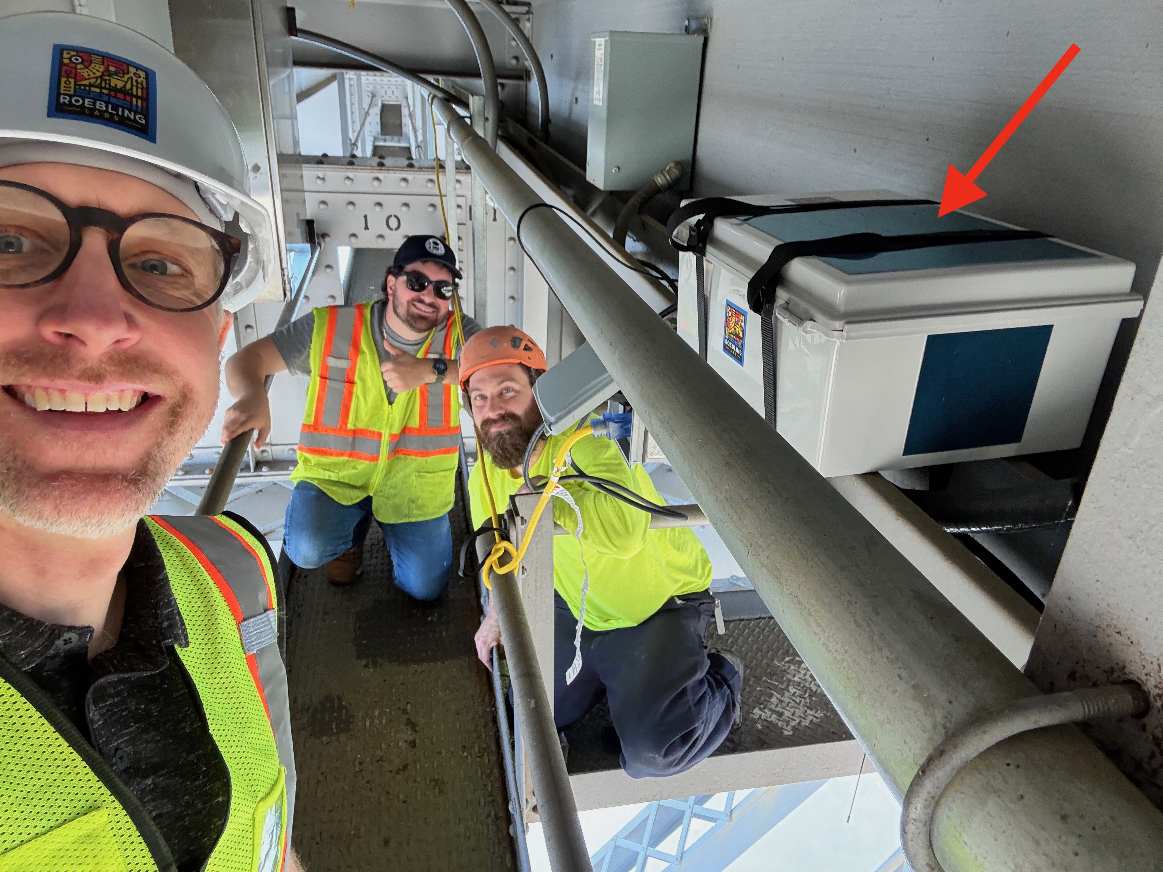 Installation team at Rip Van Winkle Bridge with vessel collision warning system hardware